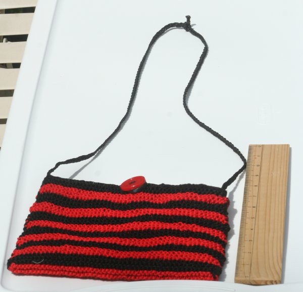 red and black striped purse